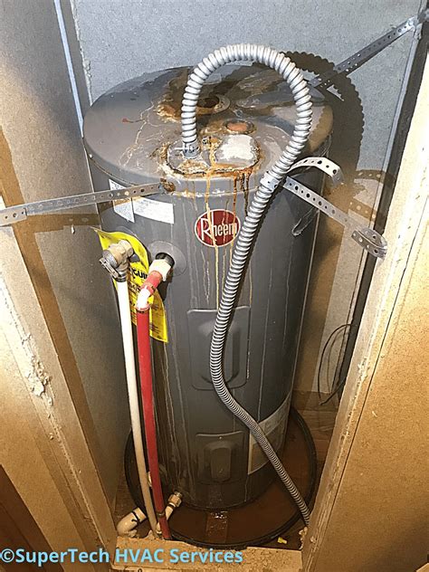 water heater leaking from top seam|Water Heater Leaking from Top: Causes and Solutions